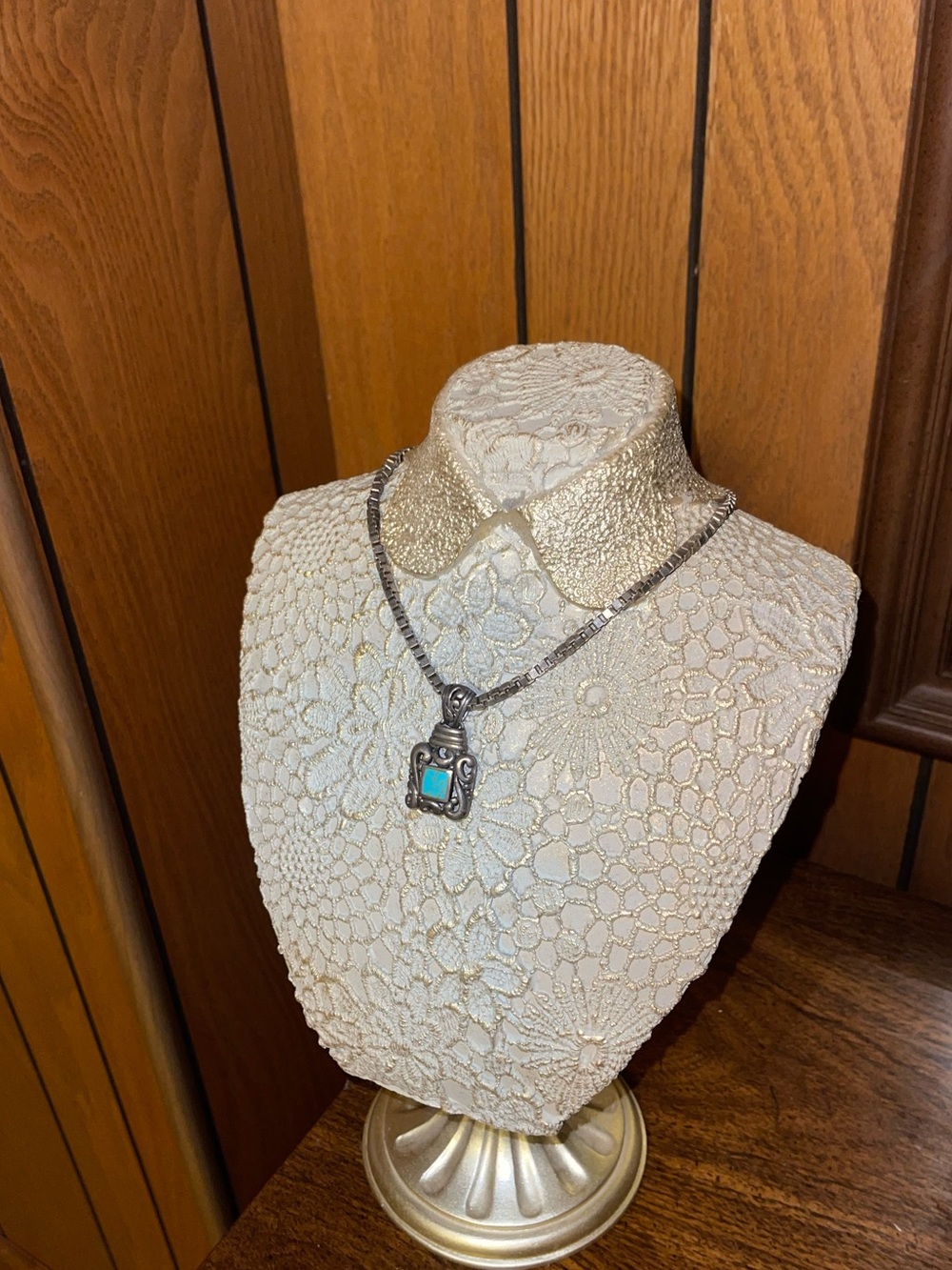 vintage Southwestern-style sterling silver pendant featuring a square turquoise